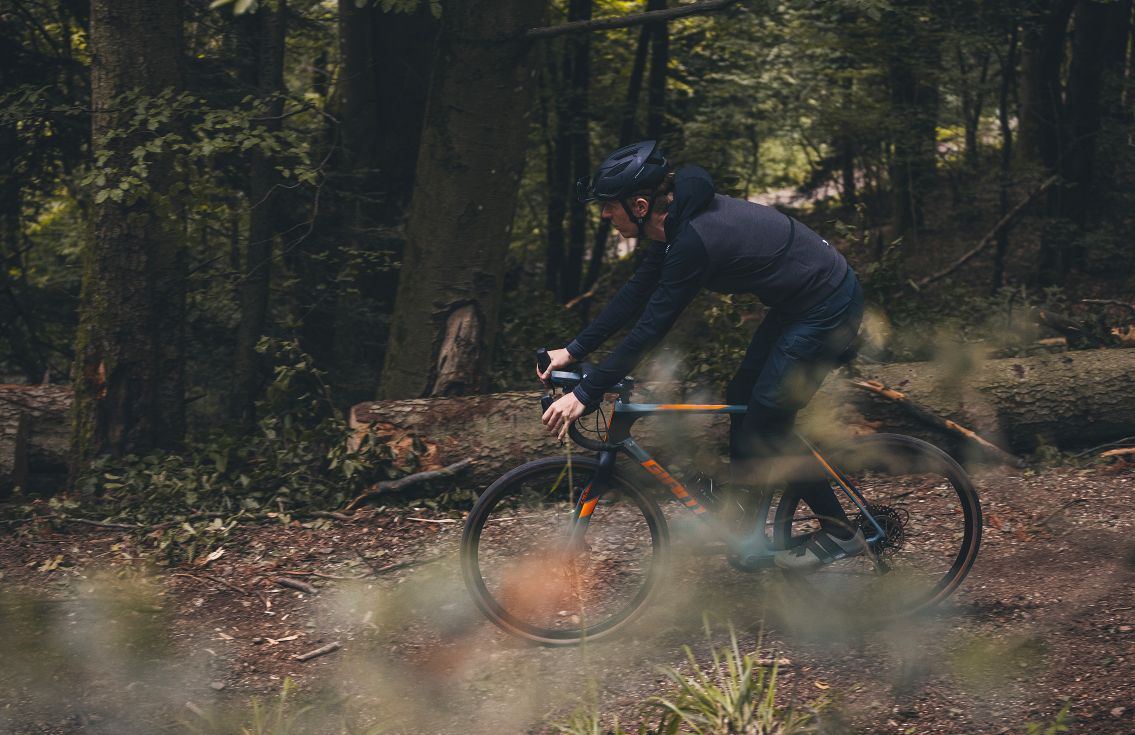 all road merino hooded jersey raven jary in action pedaled