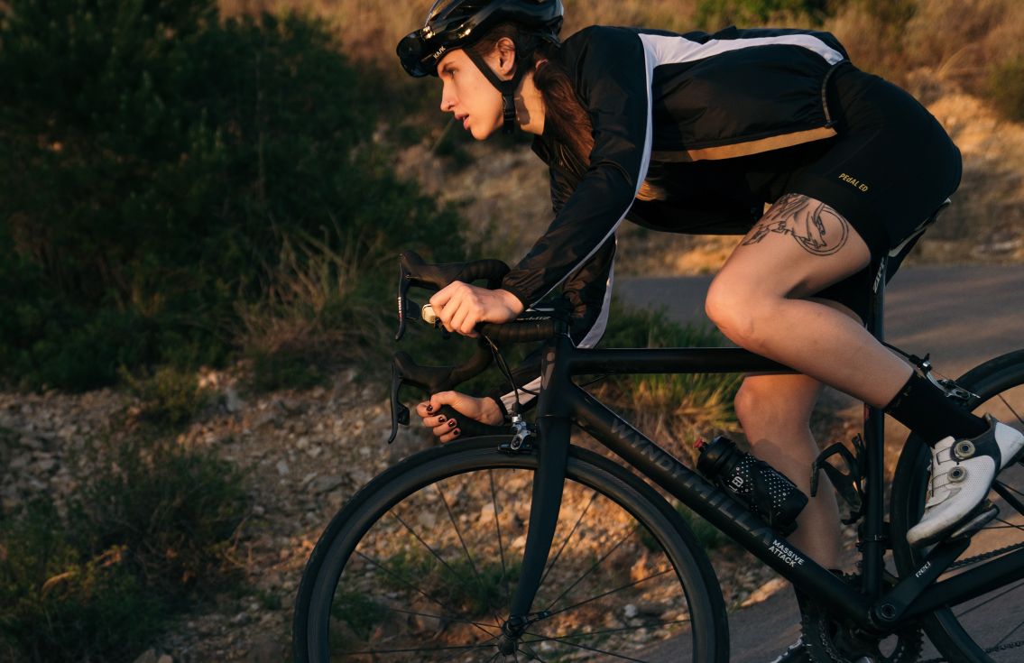 women packable cycling jacket black vesper pedaled action