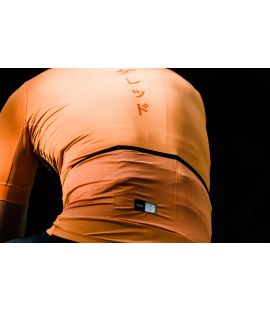 cycling jersey men orange mirai in action pedaled
