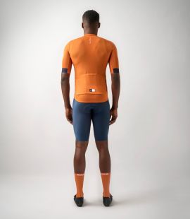 men cycling jersey orange essential total body back | PEdALED
