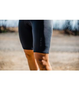 woman cycling bibshorts black essential in action pedaled