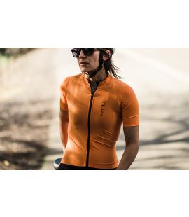 women cycling jersey road orange mirai in action pedaled