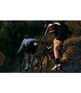 women packable cycling jacket black vesper pedaled action back